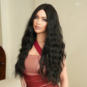 Woman with long black wig wearing a red dress against a neutral background