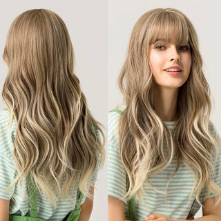 Woman with natural blonde wig wearing a striped shirt against a white background