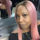 Woman with pastel pink lace front wig  in a salon setting