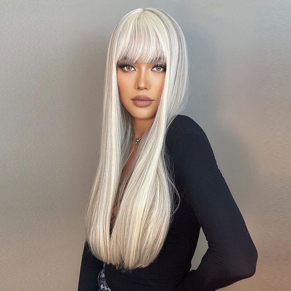 Woman with white wig with bangs against a neutral background